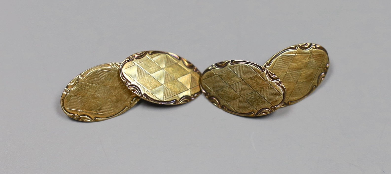 A pair of Austro-Hungarian 585 yellow metal oval cufflinks